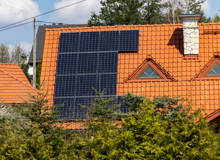 Solar electric panels on a house roofの写真素材