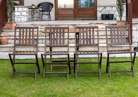 wooden chairs on the garden lawnの写真素材