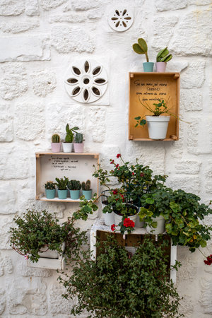 Polignano a Mare, Italy - September 17, 2019: Romantic and evocative poems written on the walls and stairs of houses in Polignano a Mare. Apulia, Bari province, Italy,のeditorial素材