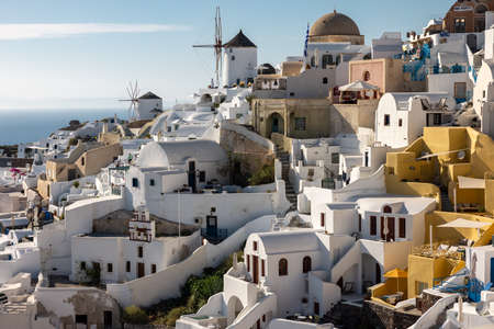Oia, Santorini, Greece - June 28, 2021: Whitewashed houses and windmills in Oia on Santorini island, Cyclades, Greeceのeditorial素材