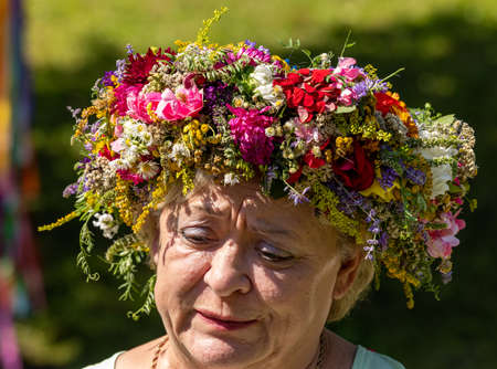 Podstolice, Poland - August 15, 2021: A woman presenting her bouquet during the 13th edition of the Miraculous Power of Bouquets, a competition for the most beautiful bouquet of flowers and herbsのeditorial素材