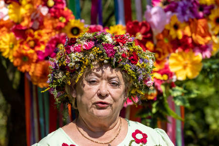 Podstolice, Poland - August 15, 2021: A woman presenting her bouquet during the 13th edition of the Miraculous Power of Bouquets, a competition for the most beautiful bouquet of flowers and herbsのeditorial素材