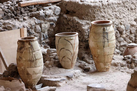 Santorini, Greece - July 01, 2021: Recovered ancient pottery in prehistoric town of Akrotiri, excavation site of a Minoan Bronze Age settlement on the Greek island of Santoriniのeditorial素材