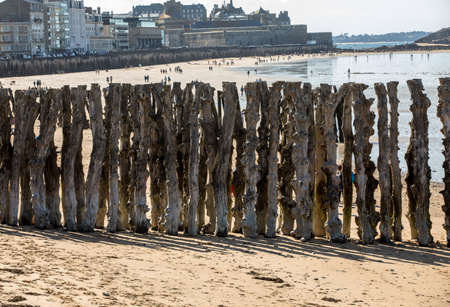 Big breakwater and beach in Saint Malo, 3000 trunks to defend the city from the tides, Ille-et-Vilaine, Brittany, Franceの写真素材