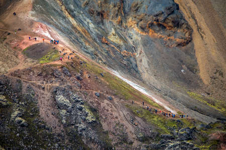 Landmannalaugar, Iceland - July 30, 2017: Hikers in volcanic mountains of Landmannalaugar in Fjallabak Nature Reserve. Icelandのeditorial素材