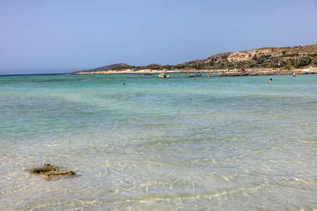 Elafonisi, Crete, Greece - Sept 19, 2021: People relaxing on the famous pink coral beach of Elafonisi on Crete, Mediterannean sea, Greeceのeditorial素材