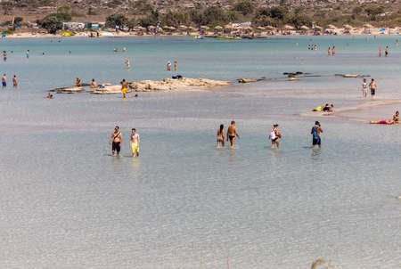 Elafonisi, Crete, Greece - Sept 19, 2021: People relaxing on the famous pink coral beach of Elafonisi on Crete, Mediterannean sea, Greeceのeditorial素材