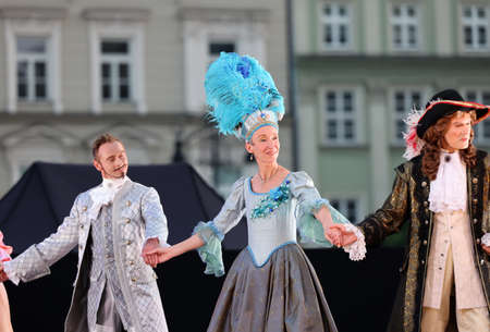 Krakow, Poland - July 25, 2021: Artists in costumes performing on stage during a show of court dances at the Main Market Square as part of the 22nd Cracovia Danza Court Dance Festivalのeditorial素材