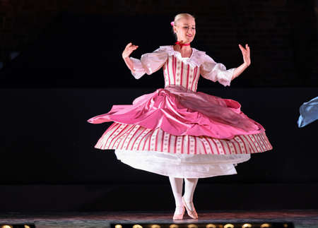 Krakow, Poland - July 25, 2021: Artists in costumes performing on stage during a show of court dances at the Main Market Square as part of the 22nd Cracovia Danza Court Dance Festivalのeditorial素材