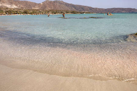 Elafonisi, Crete, Greece - Sept 19, 2021: People relaxing on the famous pink coral beach of Elafonisi on Crete, Mediterannean sea, Greeceのeditorial素材