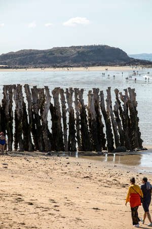 St Malo, France - September 15, 2018: Romantic walk of people before sunset on the picturesque beach of Saint Malo. Brittany, Franceのeditorial素材