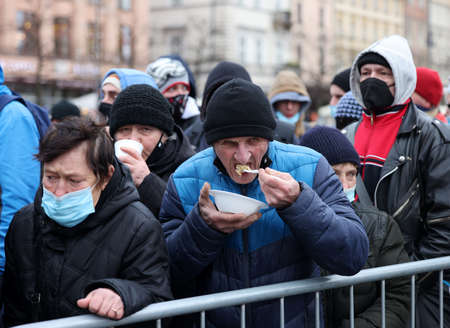 Krakow, Poland - Dec 19, 2021: Christmas Eve for poor and homeless on the Main Square in Cracow....