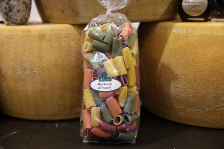 Cracow, Poland - November 5, 2021: Whole wheel of Parmigiano Reggiano cheese and Italian pasta at Enoexpo and Gastrofood - Trade Fair for Food and Drinks for Cateringのeditorial素材