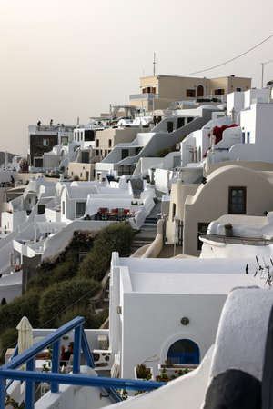Imerovigli, Santorini, Greece - July 1, 2021: Whitewashed houses with terraces and pools and a beautiful view in Imerovigli on Santorini island, Greeceのeditorial素材