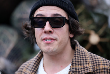 Krakow, Poland - Dec 19, 2021: Dawid Kwiatkowski during the distribution of Christmas trees at Szczepanski Square in Krakowのeditorial素材
