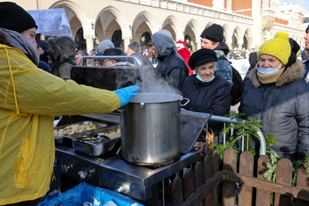 Krakow, Poland - Dec 18, 2022: Christmas Eve for poor and homeless on the Main Square in Cracow. The group Kosciuszko prepares the greatest eve in the open air in Krakowのeditorial素材