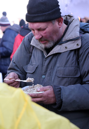 Krakow, Poland - Dec 18, 2022: Christmas Eve for poor and homeless on the Main Square in Cracow. The group Kosciuszko prepares the greatest eve in the open air in Krakowのeditorial素材