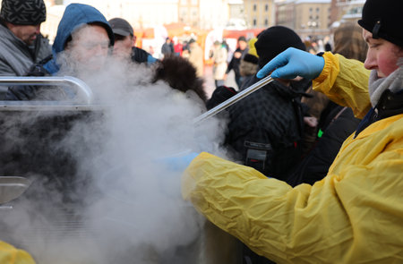 Krakow, Poland - Dec 18, 2022: Christmas Eve for poor and homeless on the Main Square in Cracow. The group Kosciuszko prepares the greatest eve in the open air in Krakowのeditorial素材