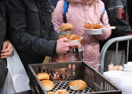 Krakow, Poland - Dec 18, 2022: Christmas Eve for poor and homeless on the Main Square in Cracow. The...