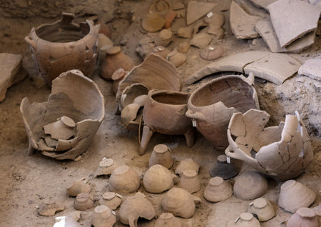 Santorini, Greece - July 01, 2021: Recovered ancient pottery in prehistoric town of Akrotiri, excavation site of a Minoan Bronze Age settlement on the Greek island of Santoriniのeditorial素材