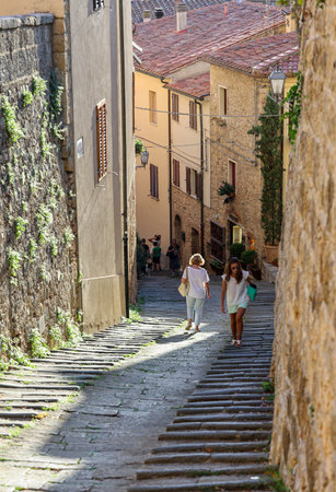 Massa Marittima, Italy - Sept 11, 2022: Steep and narrow street in old town of Massa Marittima, Italyのeditorial素材