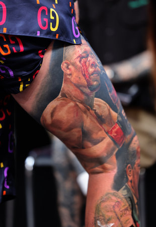 Krakow, Poland - June 12, 2022: Unidentified participant during the contest for the best tattoo at the 15th Tattoofest Convention in Cracow. One of the most prestigious tattoo festivals.のeditorial素材