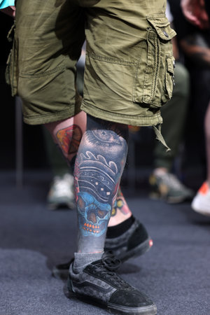 Krakow, Poland - June 11, 2022: Unidentified participant during the contest for the best tattoo at the 15th Tattoofest Convention in Cracow. One of the most prestigious tattoo festivals.のeditorial素材