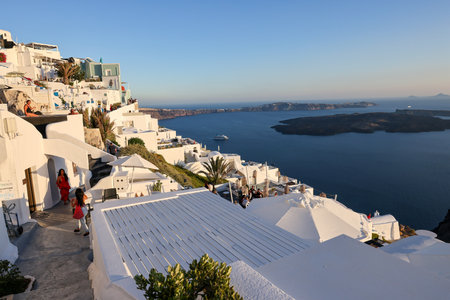 Imergovigli, Santorini, Greece - June 29, 2021: Whitewashed houses with terraces and pools and a beautiful view in Imerovigli on Santorini island, Greeceのeditorial素材