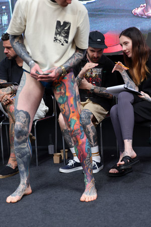 Krakow, Poland - June 12, 2022: Unidentified participant during the contest for the best tattoo at the 15th Tattoofest Convention in Cracow. One of the most prestigious tattoo festivals.のeditorial素材