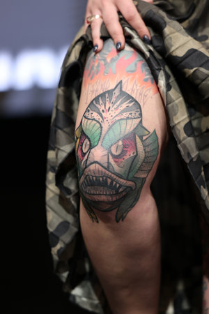Krakow, Poland - June 11, 2022: Unidentified participant during the contest for the best tattoo at the 15th Tattoofest Convention in Cracow. One of the most prestigious tattoo festivals.のeditorial素材