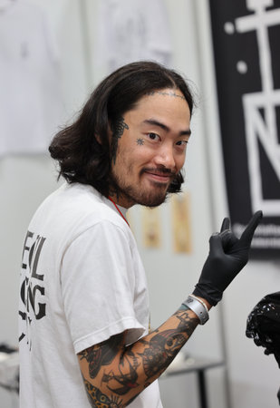Krakow, Poland - June 11, 2022: Unidentified participant at 15th Tattoofest Convention in Cracow. One of the most prestigious tattoo festivals.のeditorial素材