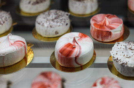 delicious milk meringues cake on golden plateの写真素材