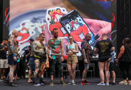Krakow, Poland - June 12, 2022: Unidentified participants during the contest for the best tattoo at the 15th Tattoofest Convention in Cracow. One of the most prestigious tattoo festivals.のeditorial素材