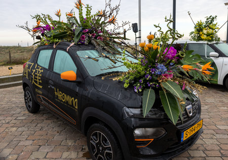 Noordwijk, Netherlands - April 22, 2023: Cars decorated with flowers taking part in the Bloemencorso Bollenstreek the annual spring flower parade from Noordwijk to Haarlem in the Netherlands.のeditorial素材