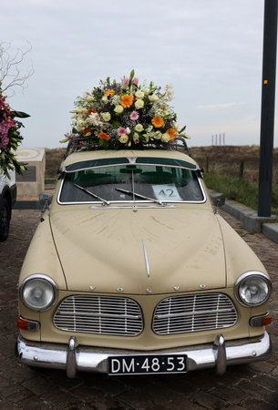 Noordwijk, Netherlands - April 22, 2023: Cars decorated with flowers taking part in the Bloemencorso Bollenstreek the annual spring flower parade from Noordwijk to Haarlem in the Netherlands.のeditorial素材