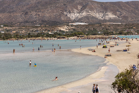Elafonisi, Crete, Greece - Sept 19, 2021: People relaxing on the famous pink coral beach of Elafonisi on Crete, Mediterannean sea, Greeceのeditorial素材