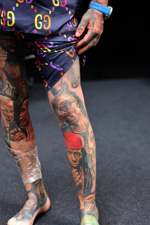 Krakow, Poland - June 12, 2022: Unidentified participant during the contest for the best tattoo at the 15th Tattoofest Convention in Cracow. One of the most prestigious tattoo festivals.のeditorial素材