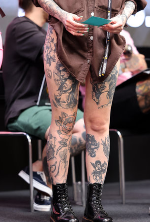 Krakow, Poland - June 11, 2022: Unidentified participant during the contest for the best tattoo at the 15th Tattoofest Convention in Cracow. One of the most prestigious tattoo festivals.のeditorial素材