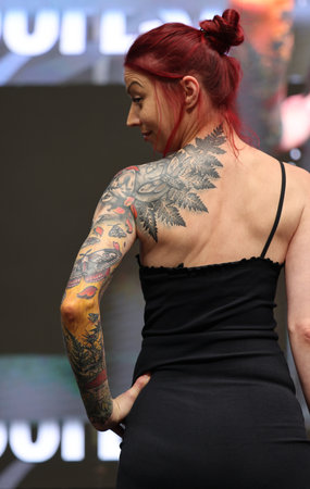 Krakow, Poland - June 11, 2022: Unidentified participant during the contest for the best tattoo at the 15th Tattoofest Convention in Cracow. One of the most prestigious tattoo festivals.のeditorial素材