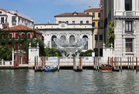 Venice, Italy - September 5, 2022: Baby 3.0 the monumental sculpture by Lorenzo Quinn in the garden of Ca' Corner della Ca' Granda palace in Venice.のeditorial素材
