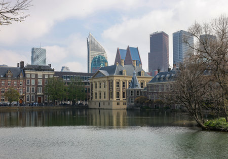 The Hague, Netherlands - April 17, 2023: The Mauritshuis museum building and Binnenhof - Dutch Parliament with Hofvijver pond, The Hague, The Netherlands;のeditorial素材