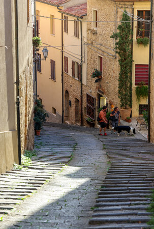 Massa Marittima, Italy - Sept 11, 2022: Steep and narrow street in old town of Massa Marittima, Italyのeditorial素材