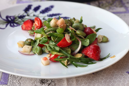 salad with strawberries and broad beans. Delicious dish in a healthy styleの写真素材