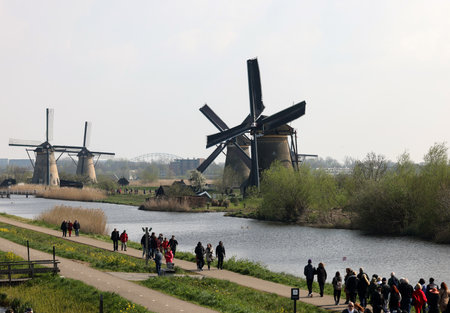 Kinderdijk, the Netherlands - April 17, 2023: 19 windmills at Kinderdijk built about 1740 is part of a larger water management system to prevent flooding. A UNESCO world heritage site.のeditorial素材