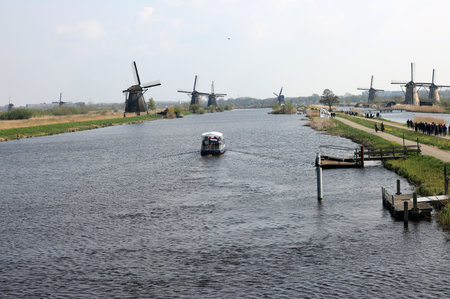 Kinderdijk, the Netherlands - April 17, 2023: 19 windmills at Kinderdijk built about 1740 is part of a larger water management system to prevent flooding. A UNESCO world heritage site.のeditorial素材