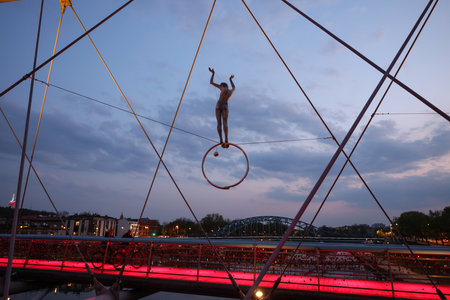 Cracow, Poland - May 2, 2022: Balancing sculptures between sky and water by Jerzy Kedziora over the Kornatka footbridge over the Vistula River in Krakowのeditorial素材