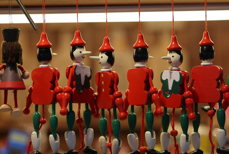 Cracow, Poland - December 19, 2021:Traditional wooden Pinocchio toy sold in souvenir shop in Cracow.のeditorial素材
