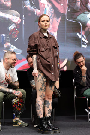 Krakow, Poland - June 11, 2022: Unidentified participant during the contest for the best tattoo at the 15th Tattoofest Convention in Cracow. One of the most prestigious tattoo festivals.のeditorial素材