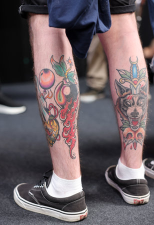 Krakow, Poland - June 11, 2022: Unidentified participant during the contest for the best tattoo at the 15th Tattoofest Convention in Cracow. One of the most prestigious tattoo festivals.のeditorial素材