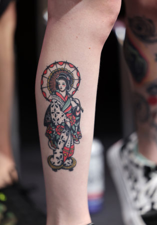 Krakow, Poland - June 11, 2022: Unidentified participant during the contest for the best tattoo at the 15th Tattoofest Convention in Cracow. One of the most prestigious tattoo festivals.のeditorial素材